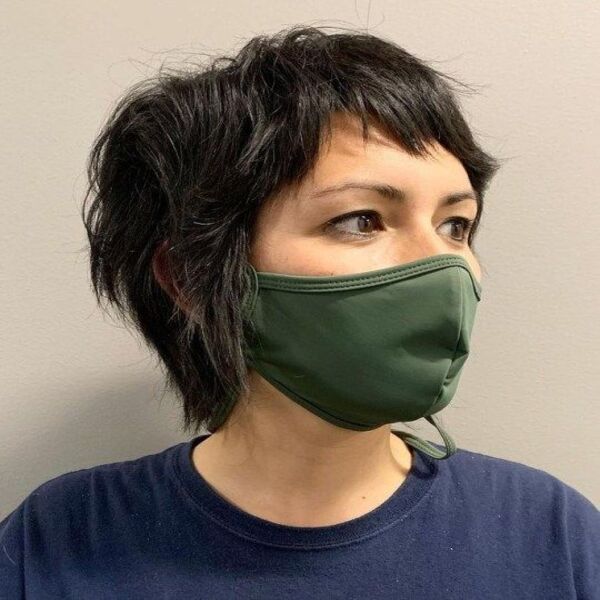 Choppy Layers Mullet Shag Hair - A woman wearing her army green mask