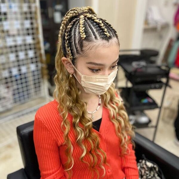 Cornrows Box Braid - A woman wearing a red long sleeve cardigan and a color brown face mask