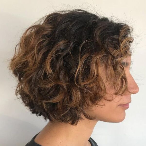 Dark Base with Blonde Highlights for Curly Bob Hair - A woman in her black top