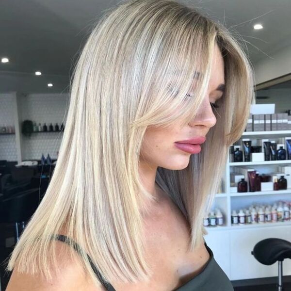 Dark Brown Roots Blonde Medium Length - A woman in her sexy top