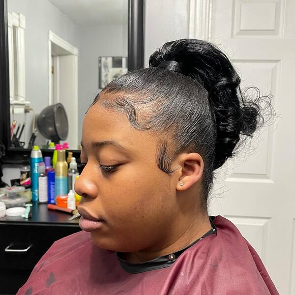 A woman with her flipped swoop hairstyle