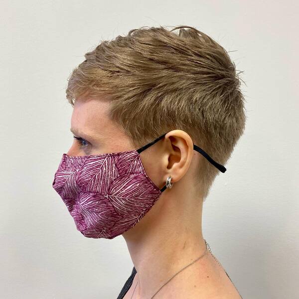 Fresh Pixie Cut - A woman wearing a violet mask