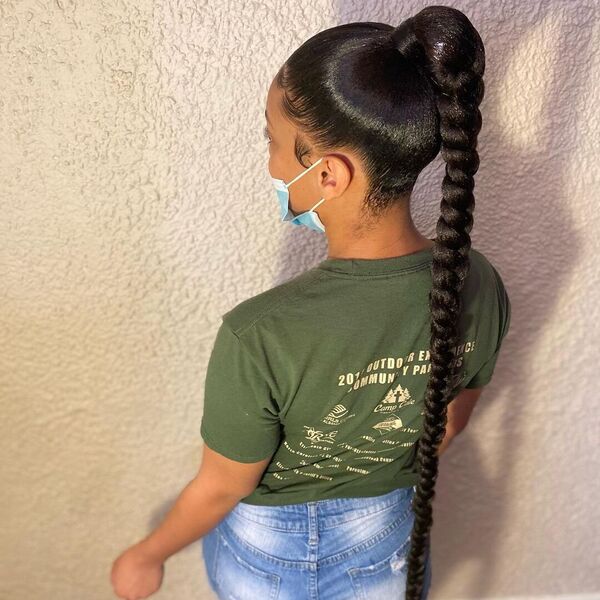 High Top Sleek Mid Braid Ponytail - A woman with face mask wearing a armygreen shirt