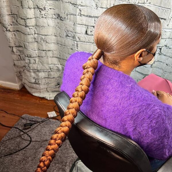 Knot Bun Braid Swoop Ponytail - A woman wearing a violet jacket