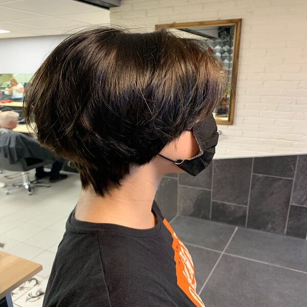 Layered Bob Shag Hair for Summer - A woman inside a salon