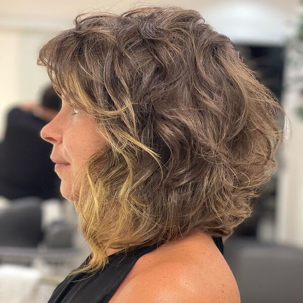 Light Brown Grey Layered Feather Shag for Medium Length Bob Hair - A woman in her sexy top