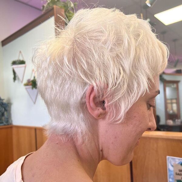 Messy and Shaggy Pixie Hairstyle - a woman wearing a white shirt