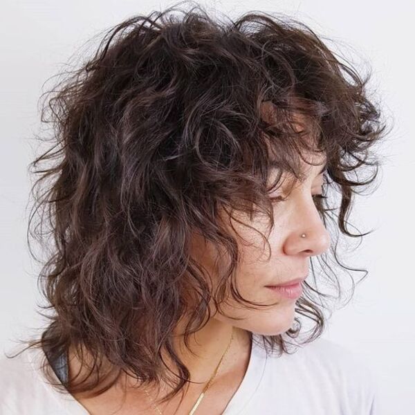 Natural Curl Shag with Curtain Bangs - A woman in her white top