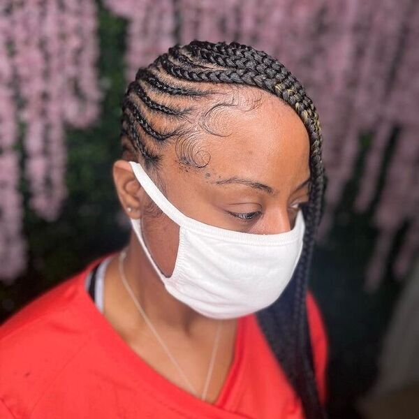 Neat Feed in Tribal Braids - A woman with white facemask wearing a red shirt