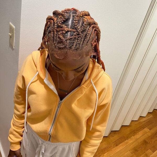 Ombre Hair Tribal Braids - A woman with necklace wearing a yellow hooded jacket