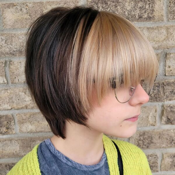 Pixie Bob Cut with Blonde Curtain Bangs - A woman wearing a glasses