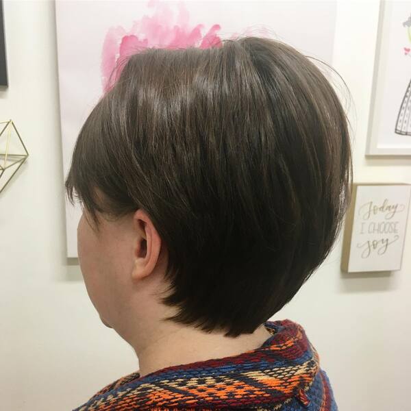 Pixie Style for Thick Hair - A woman facing the wall