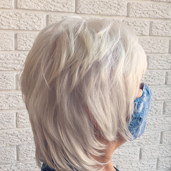 Platinum White Blonde Shag Hair for Pixie - A woman in her blue mask