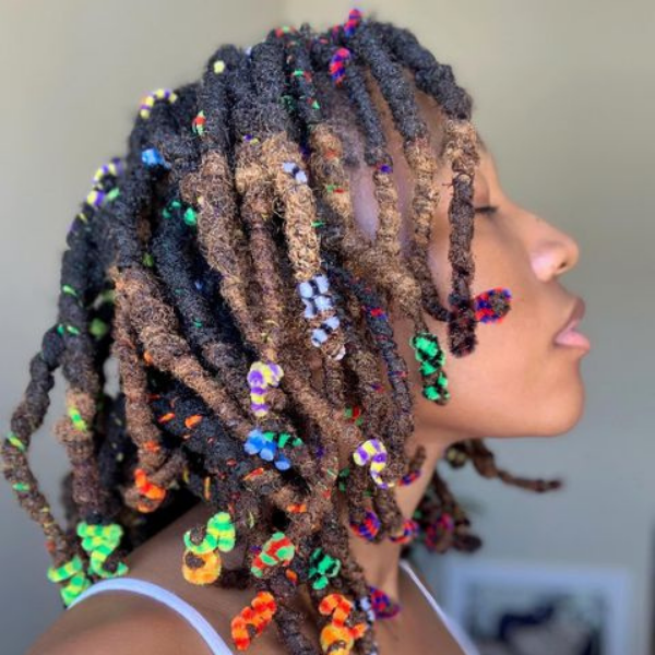 Rasta Locs Style with Accessories - A woman wearing a sleeveless top