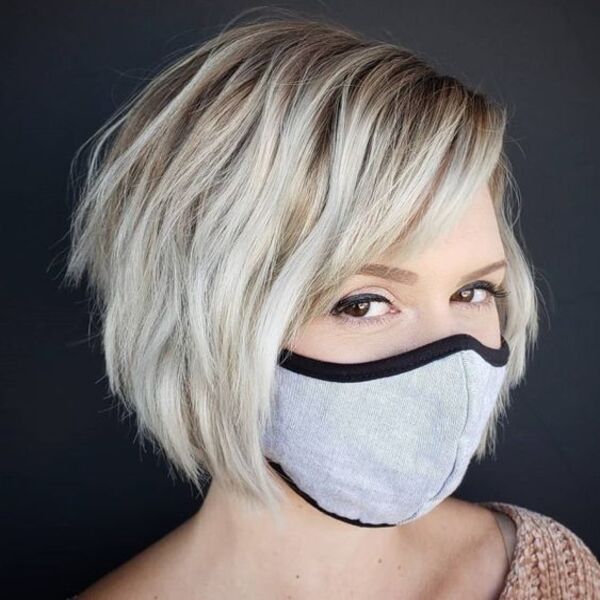 Razored End Short Shaggy Hair - A woman in her grey mask