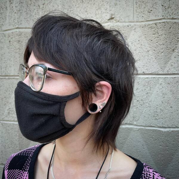 Razored Layers for Messy Thin Hair - A woman wearing a black mask