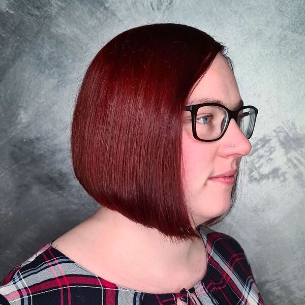 Red Dark Auburn Bob Hair - a woman wearing an eyeglasses and a checkered blouse
