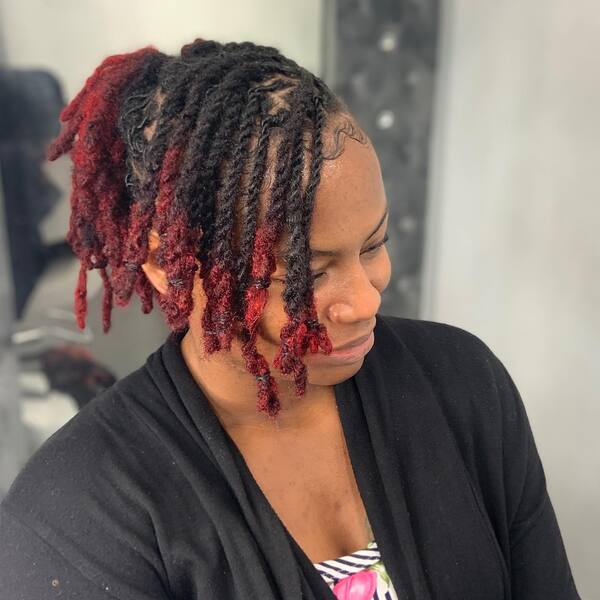 Red and Black Dreadlock - A woman wearing a black top