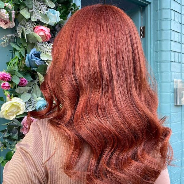 Shiny Cinnamon Auburn Half Wave Hair - a woman wearing a rose gold top