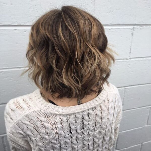 Short Shag for Brunette Hair with Highlights - A woman in her white coat