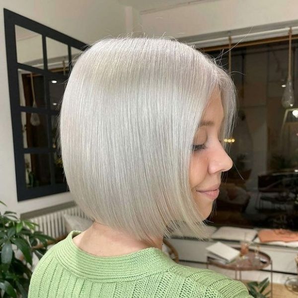 Silver Blonde Color Hair for Short Length - A woman wearing a knitted top