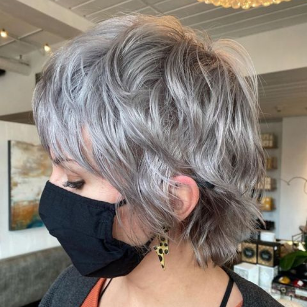 Silver Shaggy Pixie Hair for Medium Length - A woman wearing a black mask