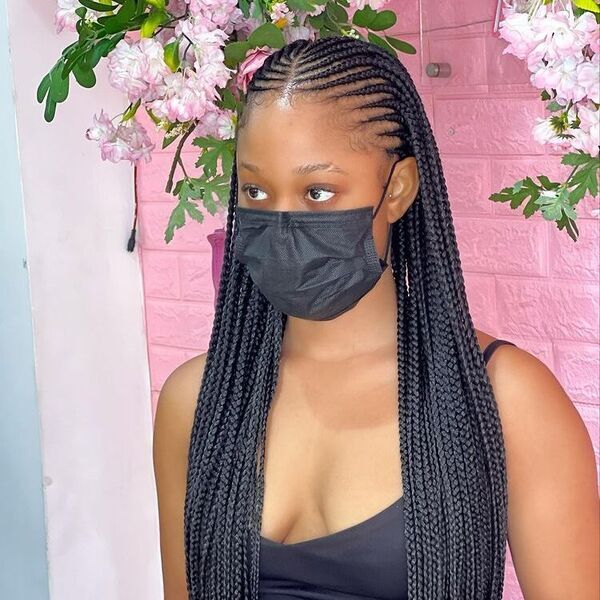 Simple and Chic Tribal Braids - A woman wearing a spaghetti strap