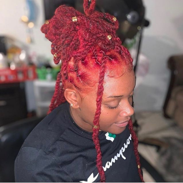 Spicy Red Dreadlock Tower Hair - A woman wearing a black top
