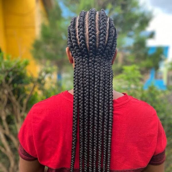 Straight Back Braid - A woman wearing a color red shirt