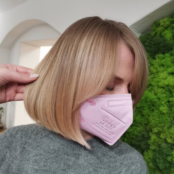 A woman with her straight balayage bob hairstyle