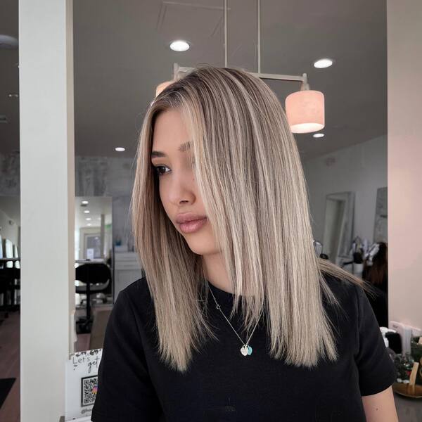 A woman with her straight balayage hair