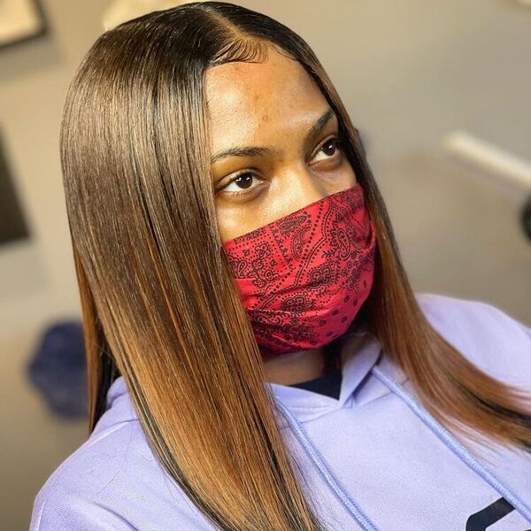 Traditional Sew in Small Leave Out with Weave - A woman with red face mask wearing a purple hooded jacket