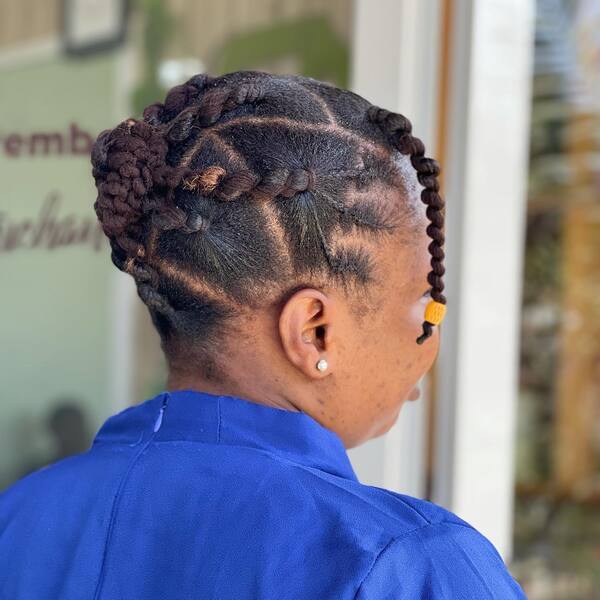 Twist Out with Decor - A woman with hair decor wearing a blue blouse