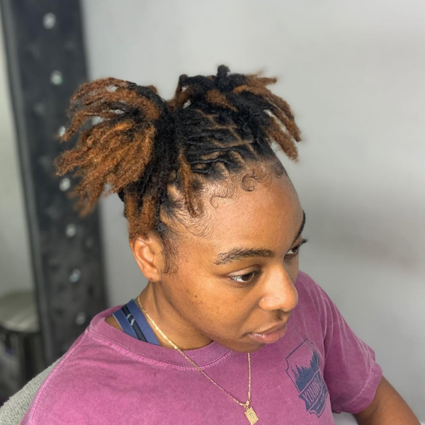 Two Short Free Form Dreads Hair - A woman wearing a violet top