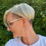 Under Cut Spiky Pixie Hairstyle - A woman wearing a white shirt