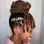 Very High Buns with Dreaded Bangs Hair - A woman wearing an earrings