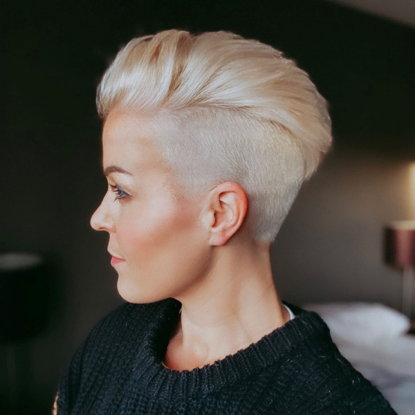 Wavy Pixie Hair with Undercut - A woman wearing a black sweater