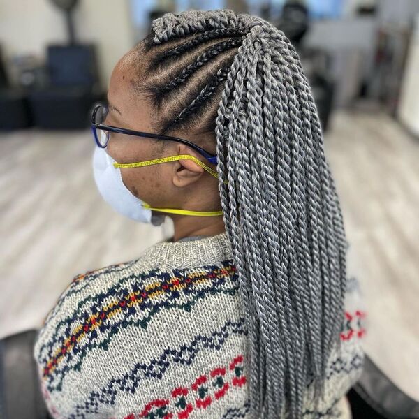 2 Strand Twist Cornrow Braids - A woman with eyeglasses wearing a knitted sweater