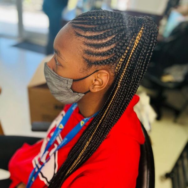 African Cornrow Ponytail - A woman with gray facemask wearing a red hooded jacket