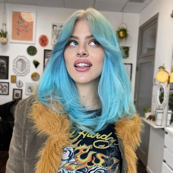 Bleach Hair Roots & Icy Blue Color - a woman wearing a jacket