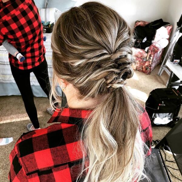 Blonde Fishtail Updo Ponytail - A woman wearing a ckeckered longsleeve
