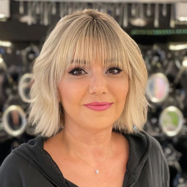 Blunt Bob with Full Fringe - a woman in a portrait