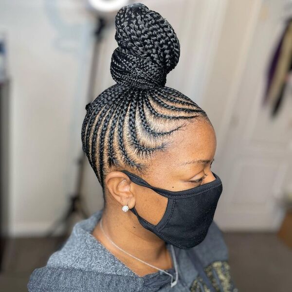 Braided Ponytail Bun - A woman with black facemask wearing a gray jacket