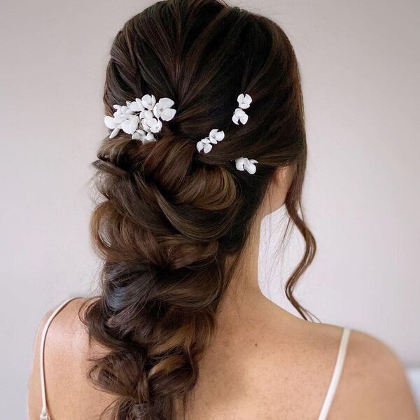 Brunette Hair Ponytail Updo with Decor - A woman wearing a sleeveless top