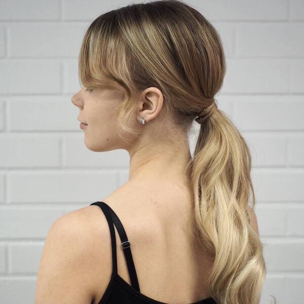 Casual Ponytail with Highlights - A woman wearing a black sleeveless