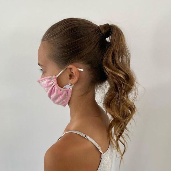 Classic Ponytail with Blonde and Wrap - A woman with facemask wearing a spaghetti strap shirt