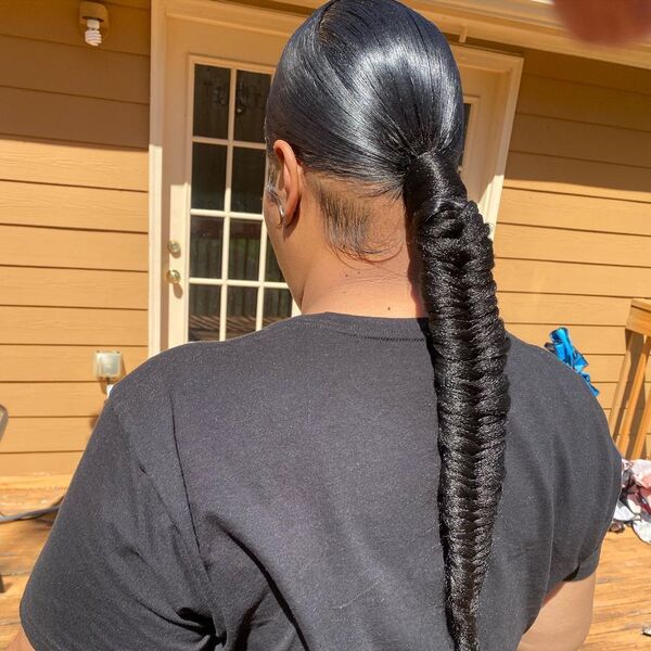 Classic Ponytail with Fishtail - A woman wearing a black shirt