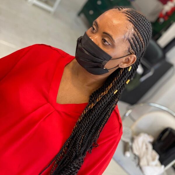 Congolese Cornrows Braids - A woman with black facemask wearing a red longsleeve blouse