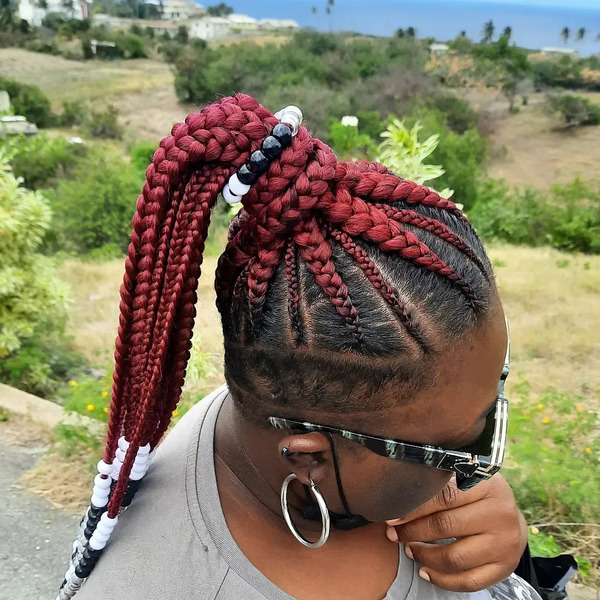 Long Cornrows With Tapered Cut - a woman wearing a sunglasses