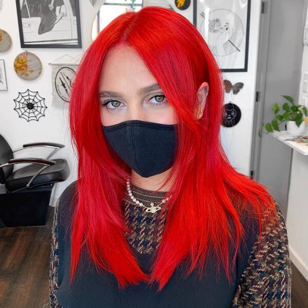 Cosmic Red Curtain Fringe Style - a woman wearing a face mask